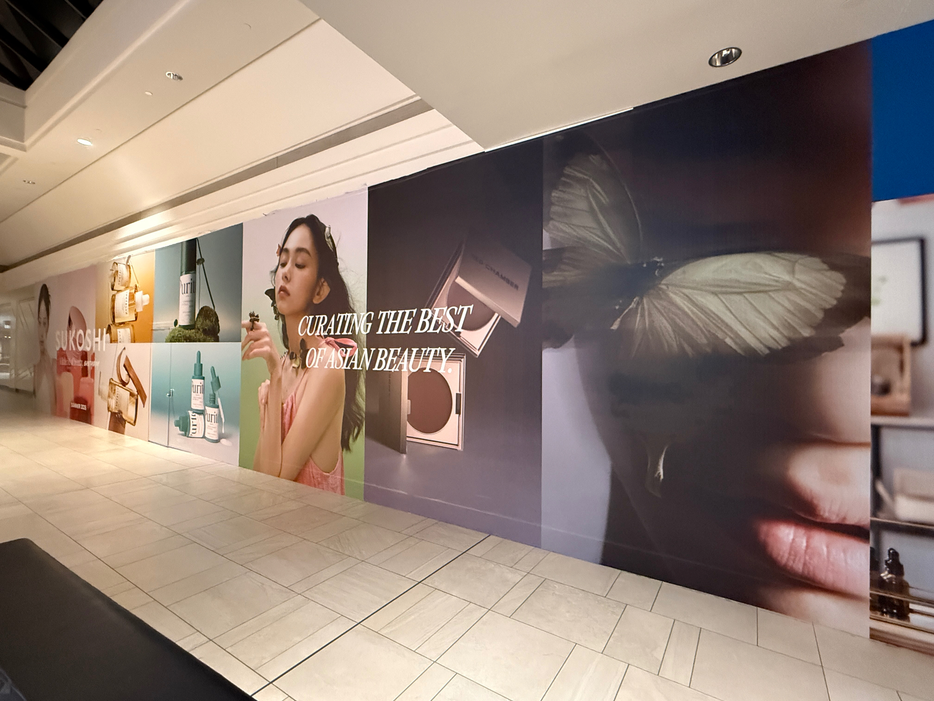 Asian beauty retail hoarding graphics with a skincare product collage