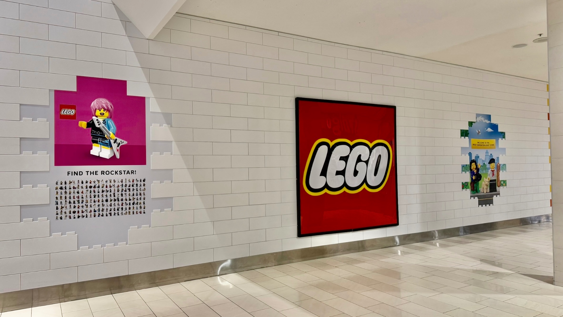 LEGO character poster hoarding graphics at a mall construction barrier