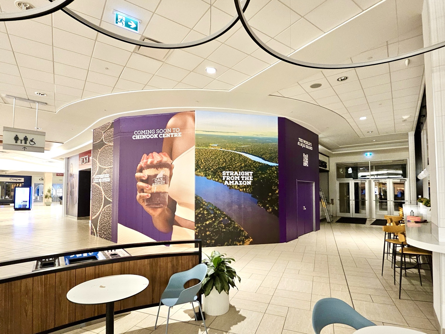 Oakberry coming-soon hoarding graphics with aerial Amazon imagery at Chinook Centre