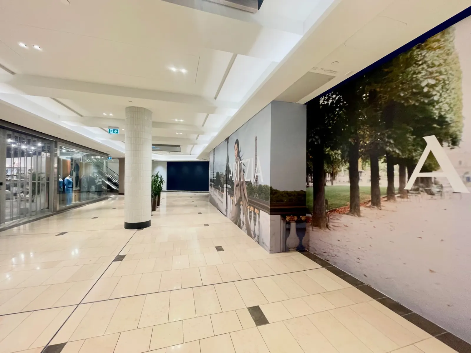 Wrapped corner return of the Aritzia hoarding at CF Pacific Centre