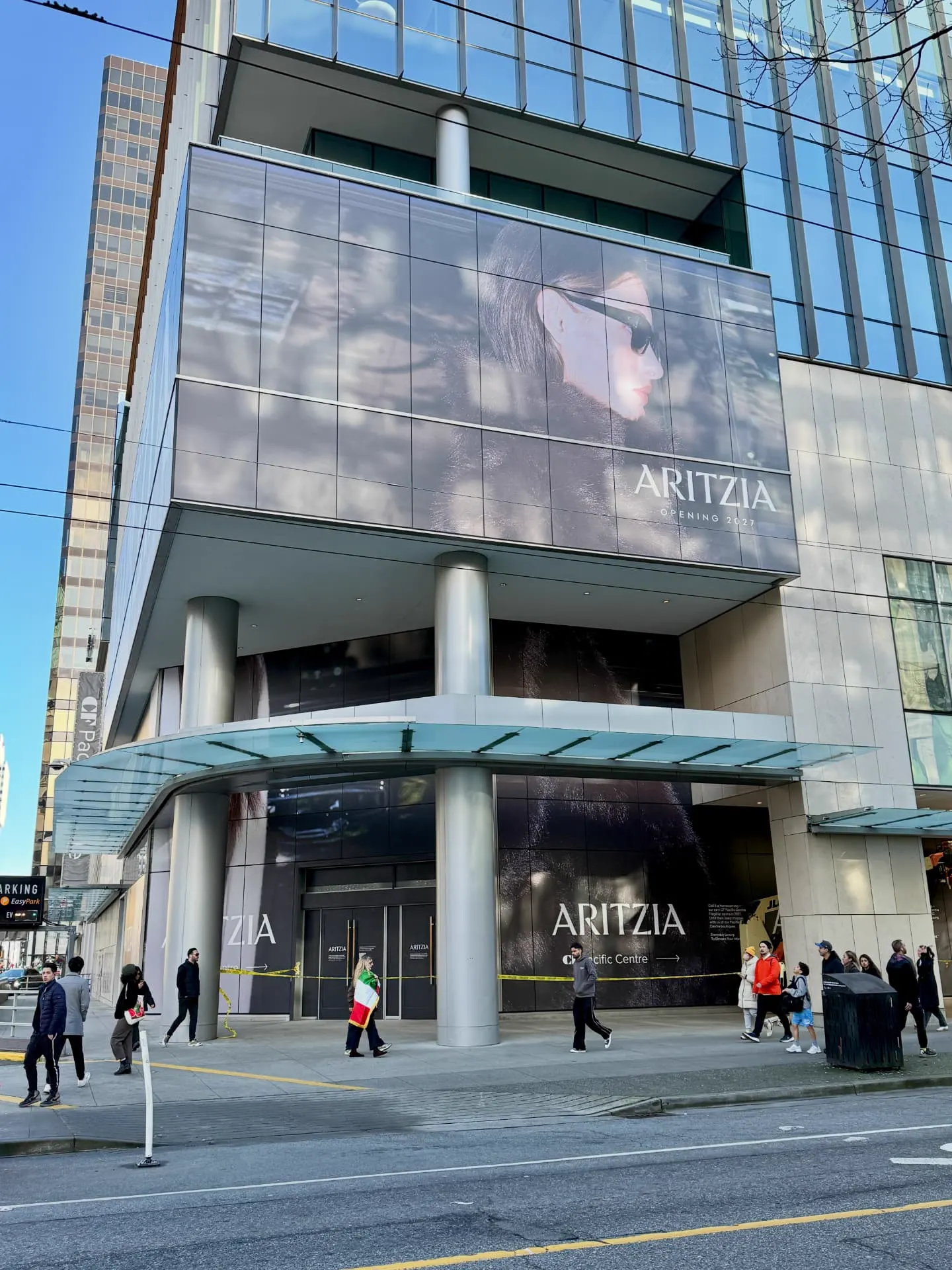Aritzia window graphics seen from street level on Robson Street