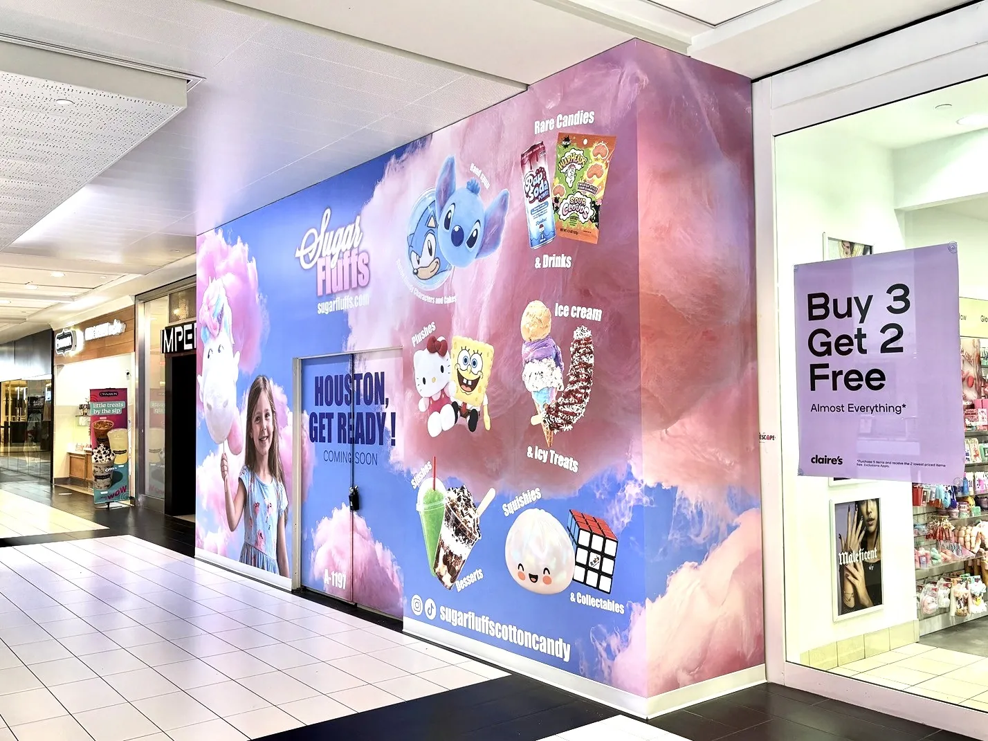 Sugar Fluffs barricade wrapping the corner return beside Claire's, Houston Galleria