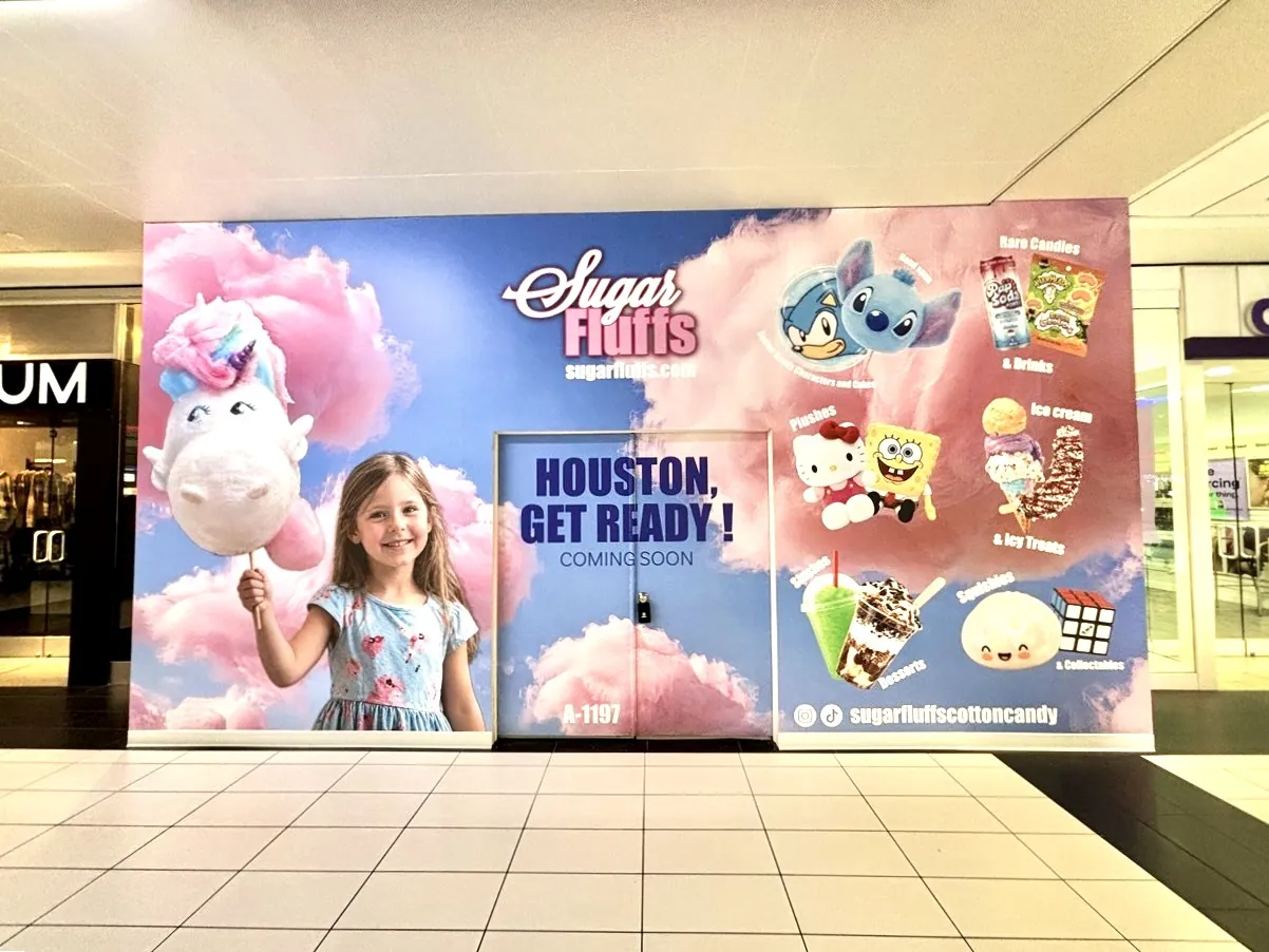 Full-coverage Sugar Fluffs barricade graphics at Houston Galleria